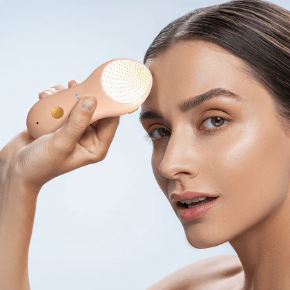 Smiling woman using Nebulyft Rosé for skin tightening